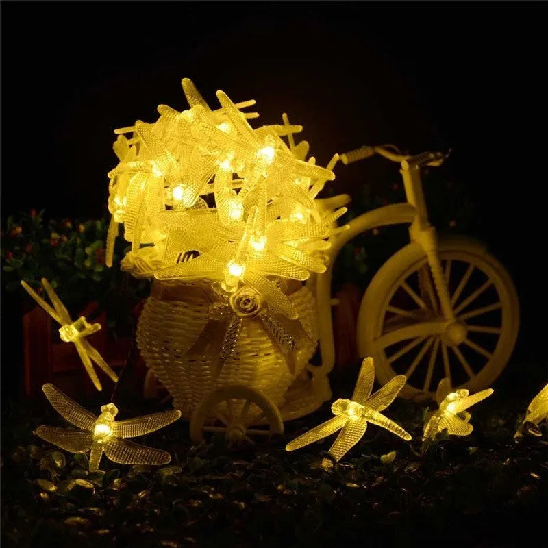 Outdoor solar LED string lights with dragonfly solar panel showing 5 metre length and IP65 waterproof construction