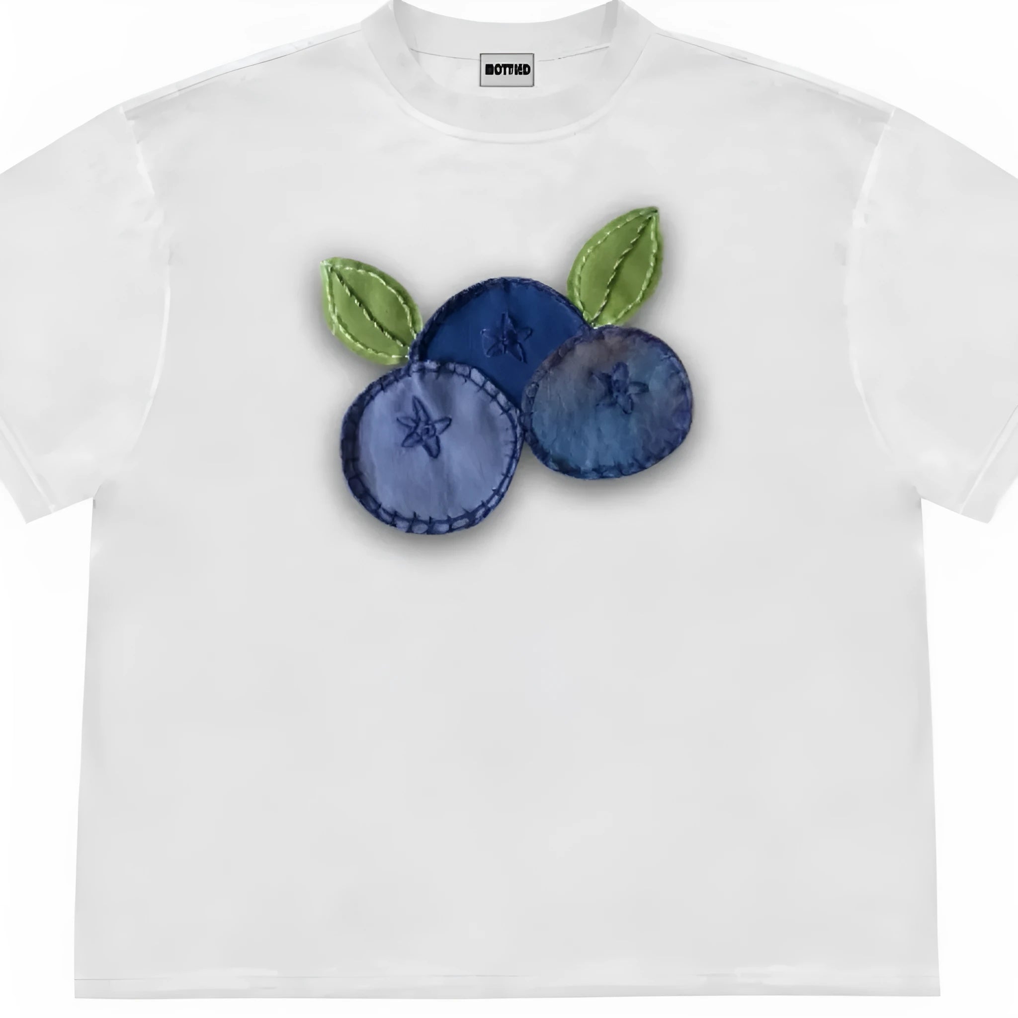 Loose fit blueberry fruit patchwork print short sleeve T-shirt on a hanger