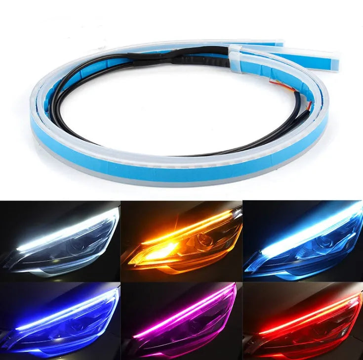 60cm ultra-thin car LED tear light guide strip in white yellow two-colour mode on a dark background