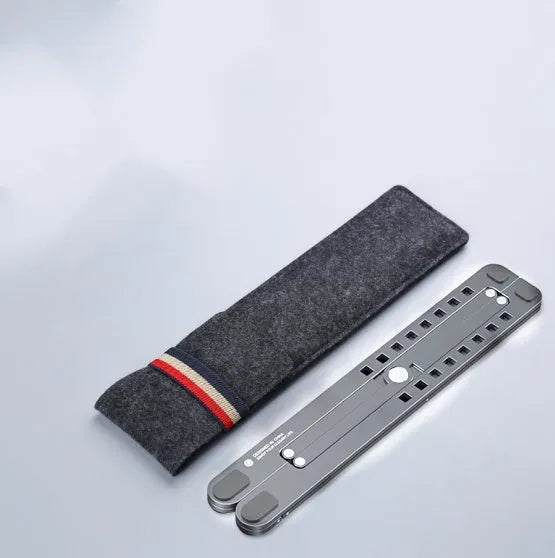 A folded and unfolded aluminium laptop stand in silver, shown next to a laptop.