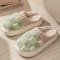 Women's plush round-toe slippers in grey, showing car suture detail and a flat PVC sole.