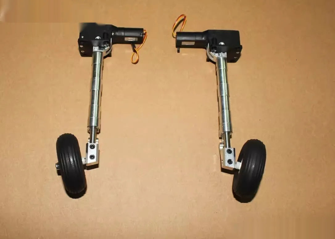 Alloy retractable shock-absorbing landing gear for RC toy aircraft with choice of wheels.