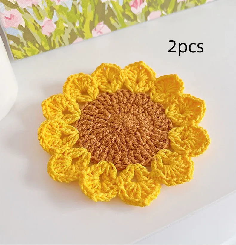 Hand-woven wool flower coaster set showing textured surface and floral pattern