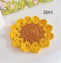 Hand-woven wool flower coaster set showing textured surface and floral pattern