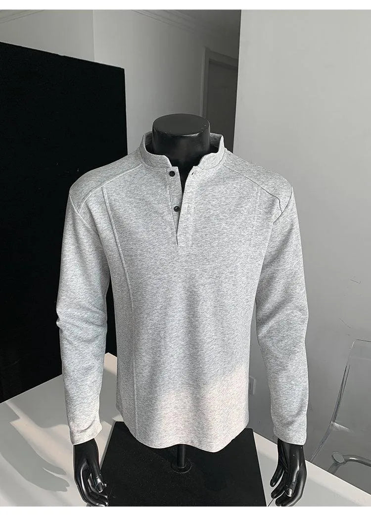 Men's grey asymmetric patchwork polo shirt with a stand-up collar, long sleeves, and a loose fit.