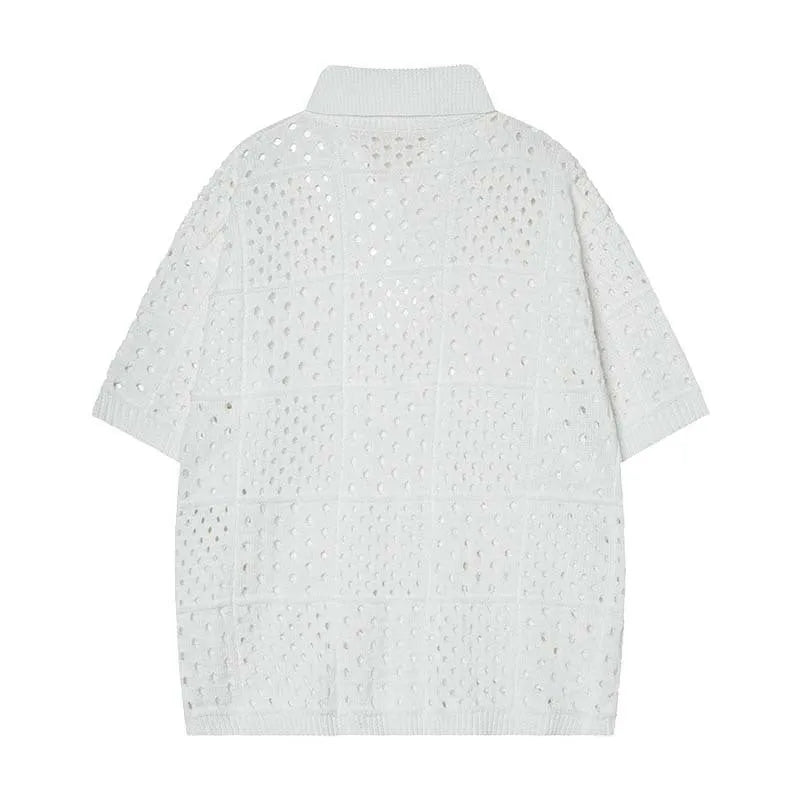 Teenager wearing a loose black short-sleeved polo shirt with a hollow knit design.