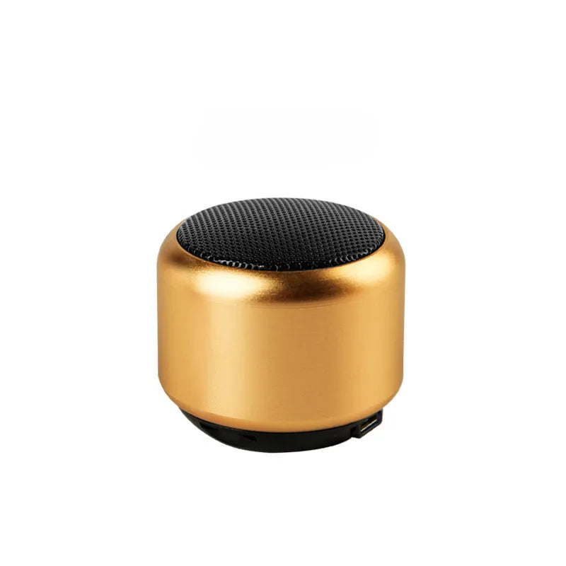 Small portable Bluetooth mini speaker shown in black, blue, gold, and pink colour options.