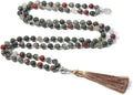 Long handmade necklace with 108 small round stone beads on a black cord, shown doubled up.