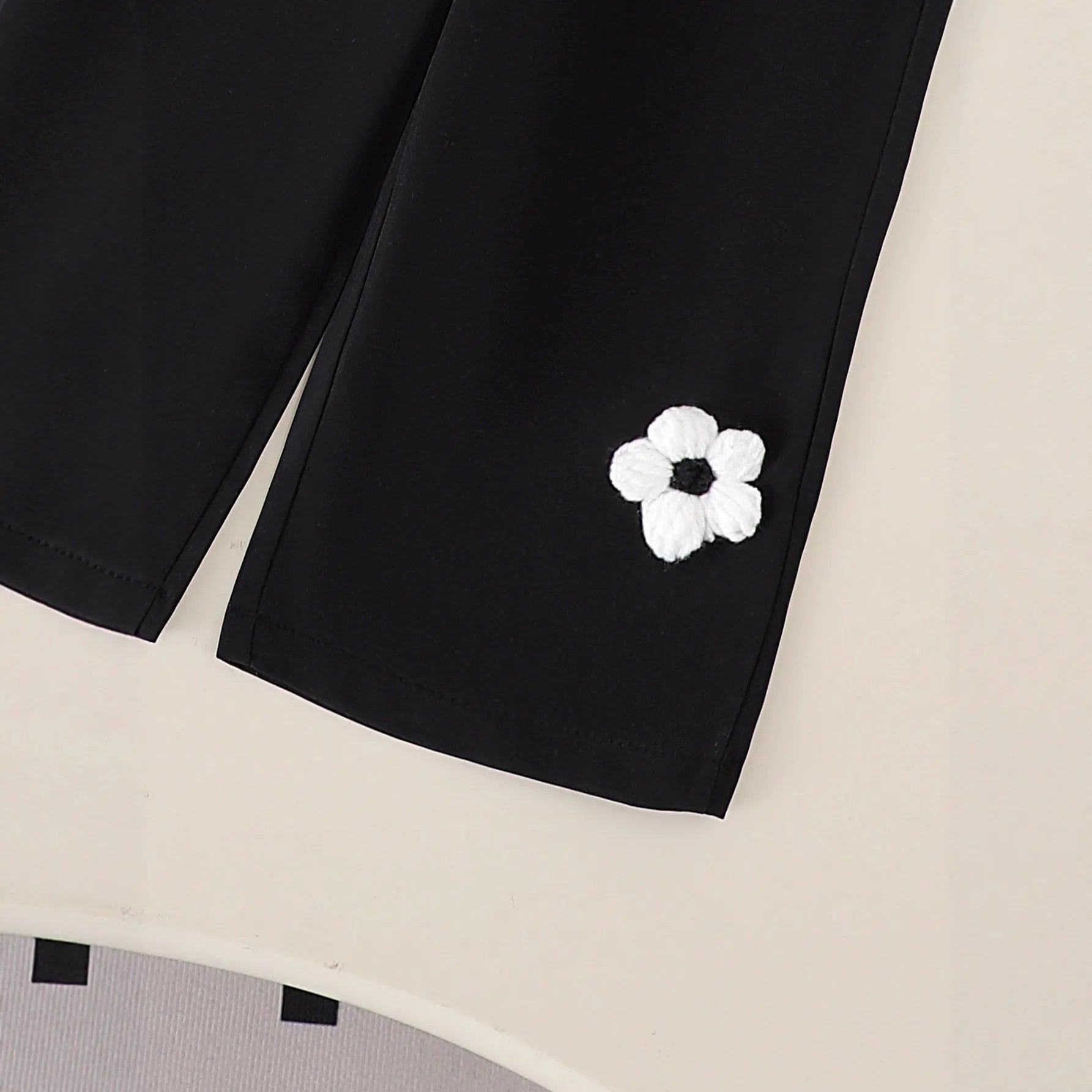 Baby girl cotton outfit set with white long-sleeved wool flower top and black trousers for toddlers 6 months to 3 years