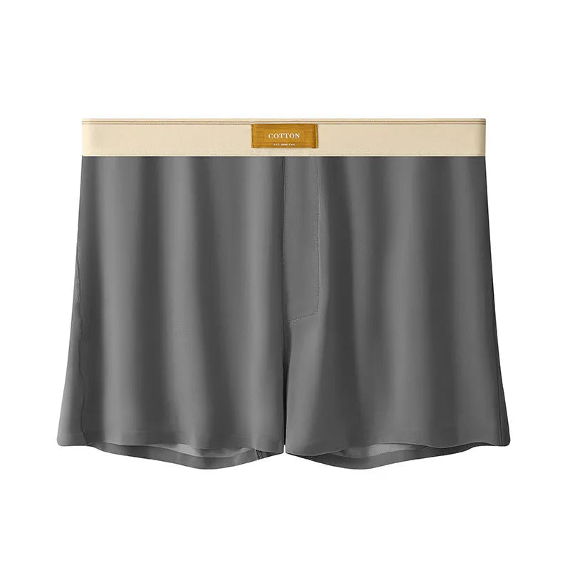 Pack of men's solid colour ice silk boxer shorts showing loose fit and mid-waist design.