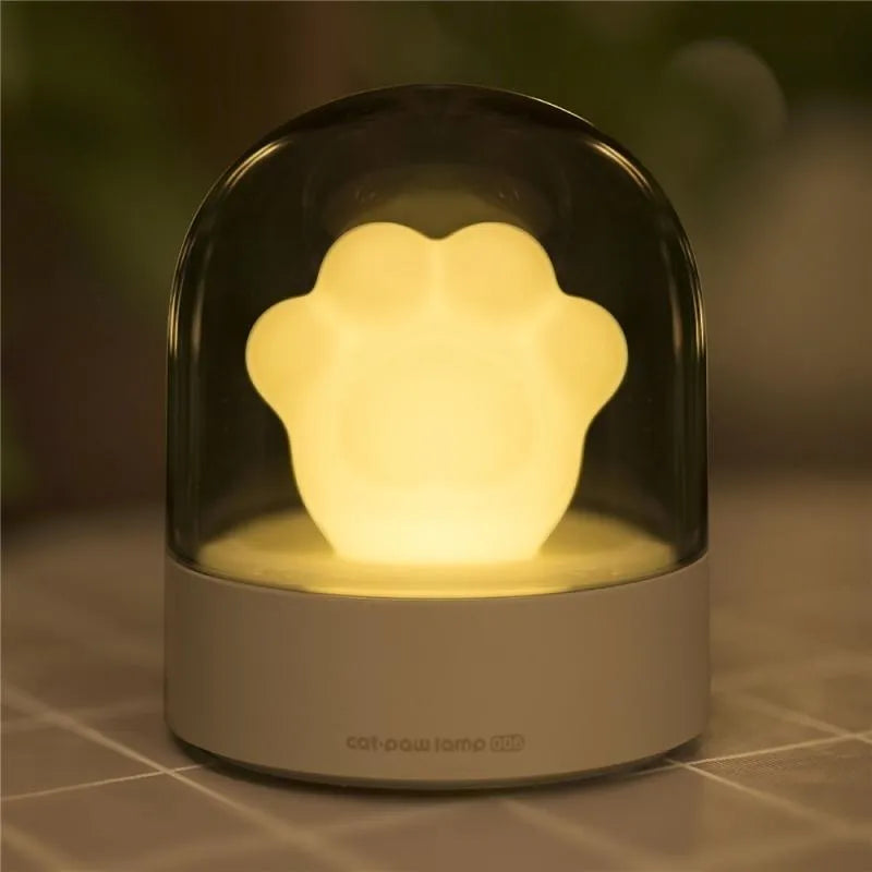 Grey and pink cat paw shaped USB rechargeable musical night light with adjustable brightness