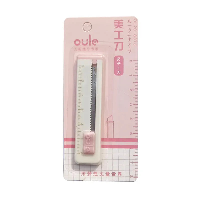 Small plastic-blade art knife in blue, pink, purple, orange, and khaki colours.