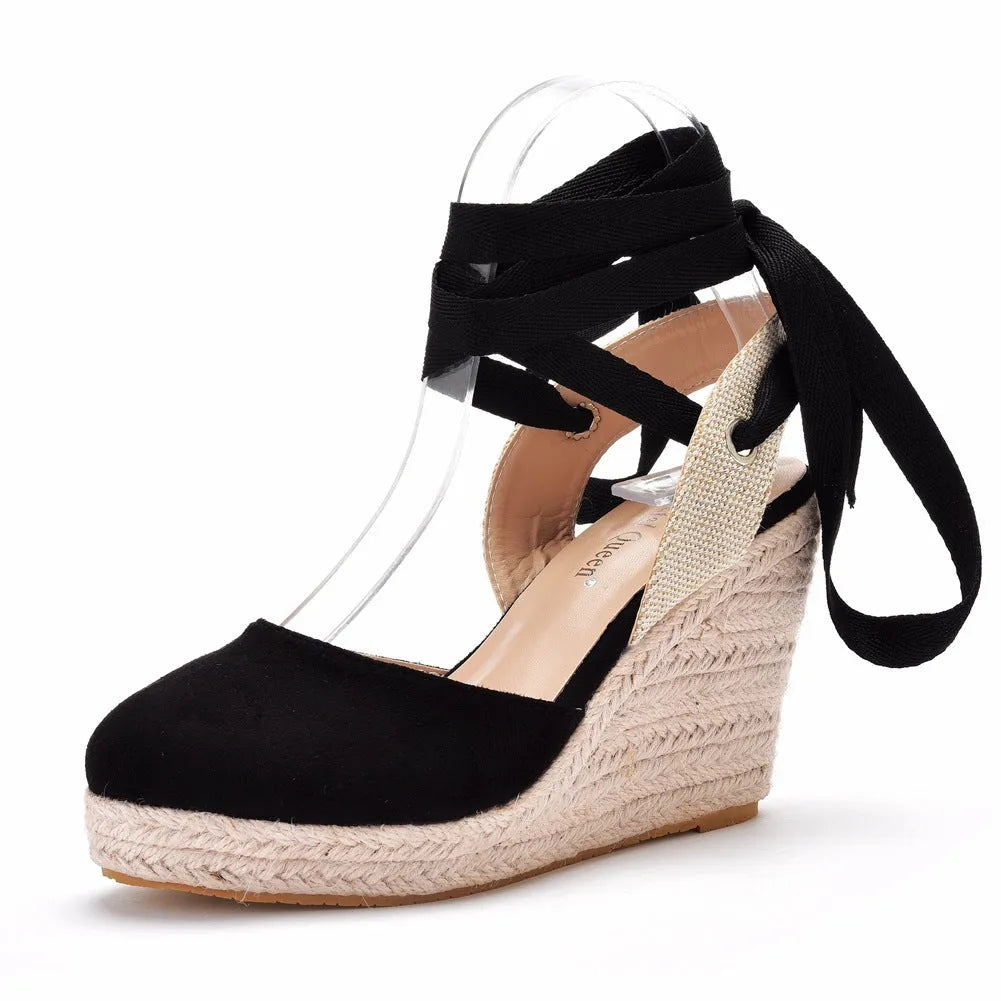 Women's red bohemian wedge sandals with beads, a buckle, and a fish mouth toe.