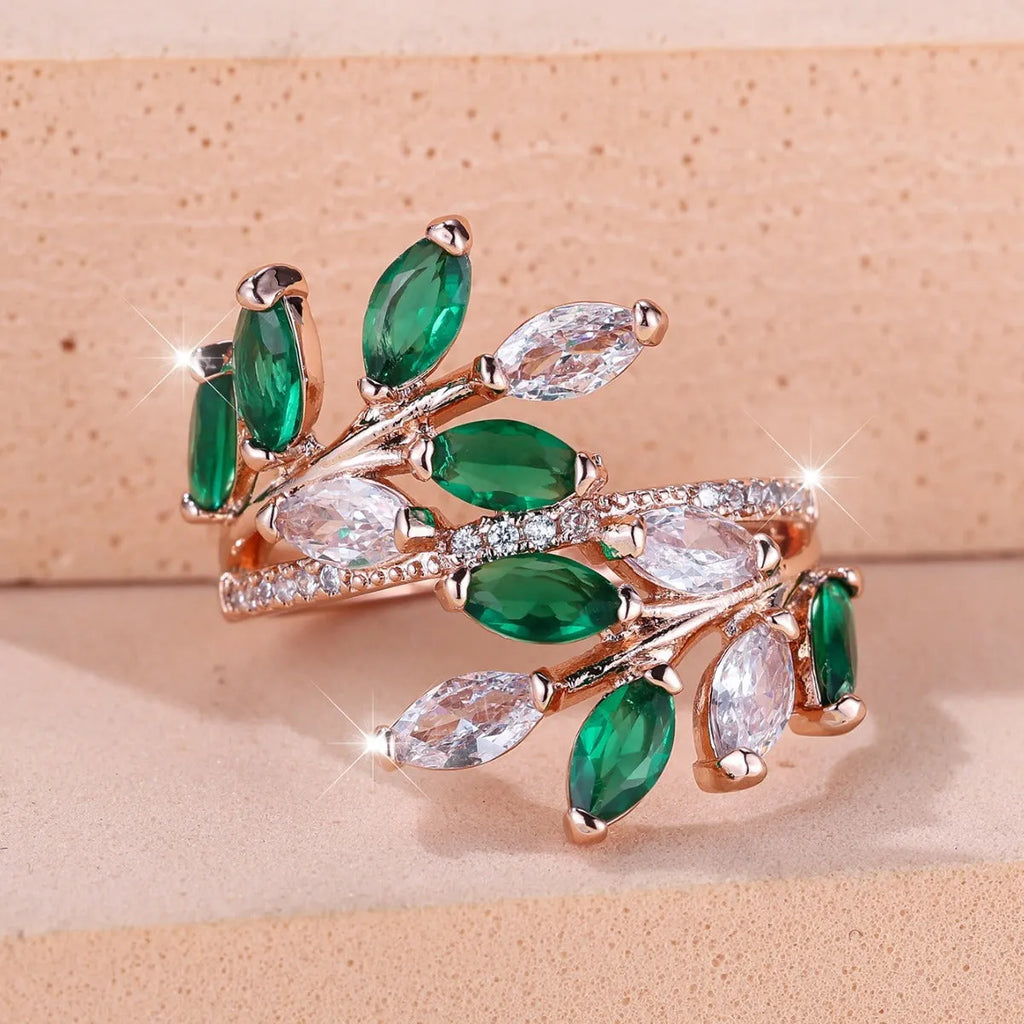 Adjustable copper leaf fashion ring with a central horse eye zircon stone, shown in a rose gold finish.