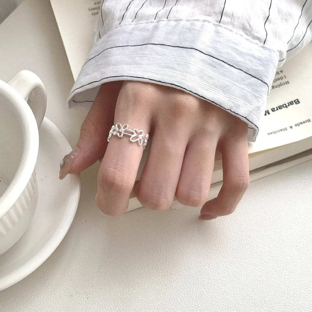 S925 sterling silver irregular hollow-out flower ring with adjustable opening in silver colour