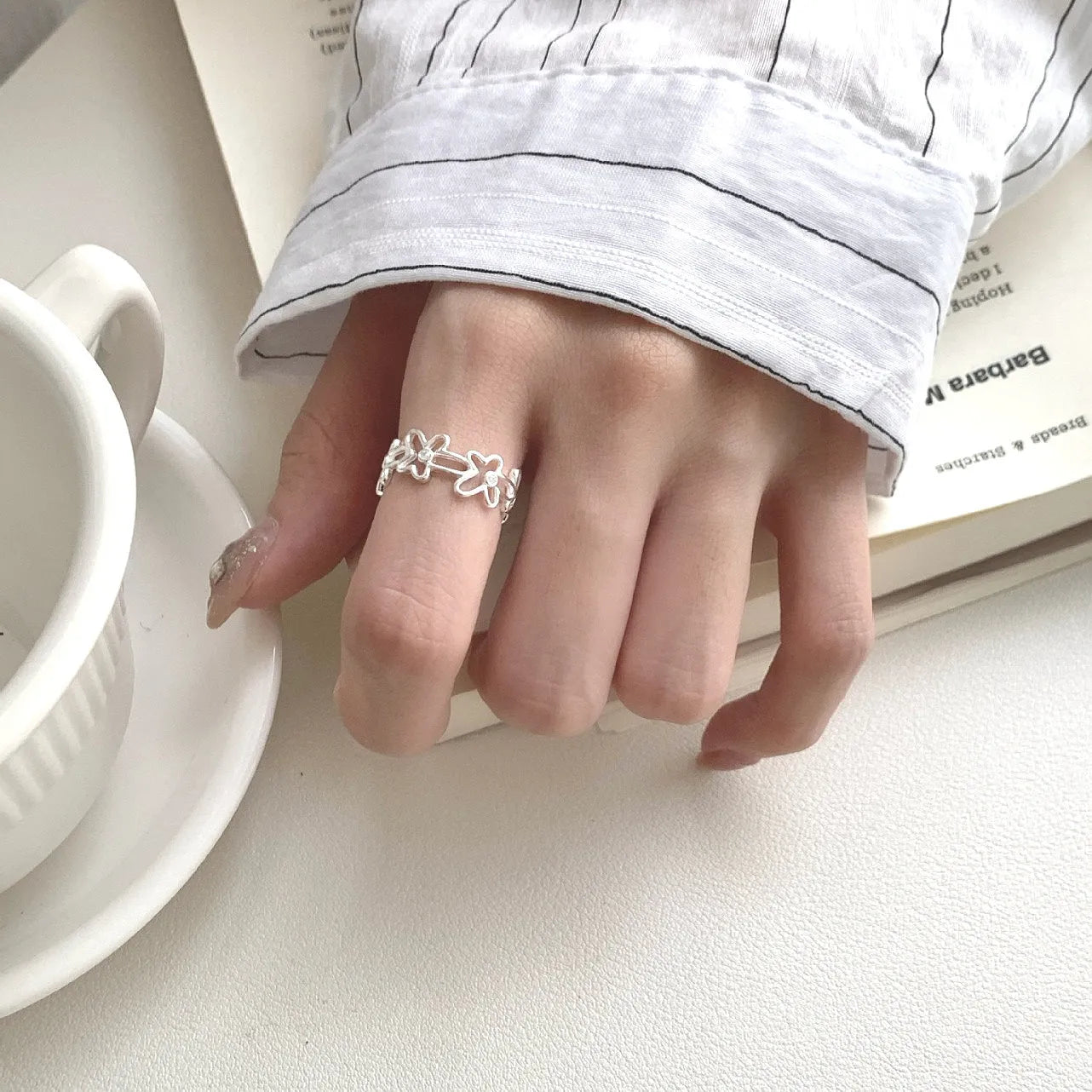 S925 sterling silver irregular hollow-out flower ring with adjustable opening in silver colour