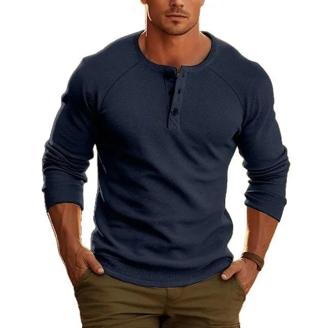 Men's white long-sleeved t-shirt with a Henry collar laying flat.