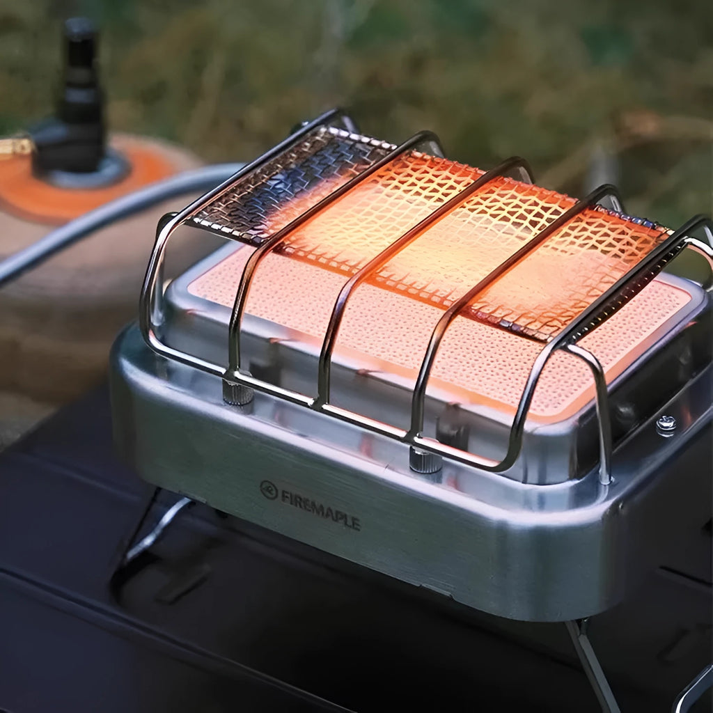 Portable stainless steel electric heating stove with ceramic elements, shown with dimensions.