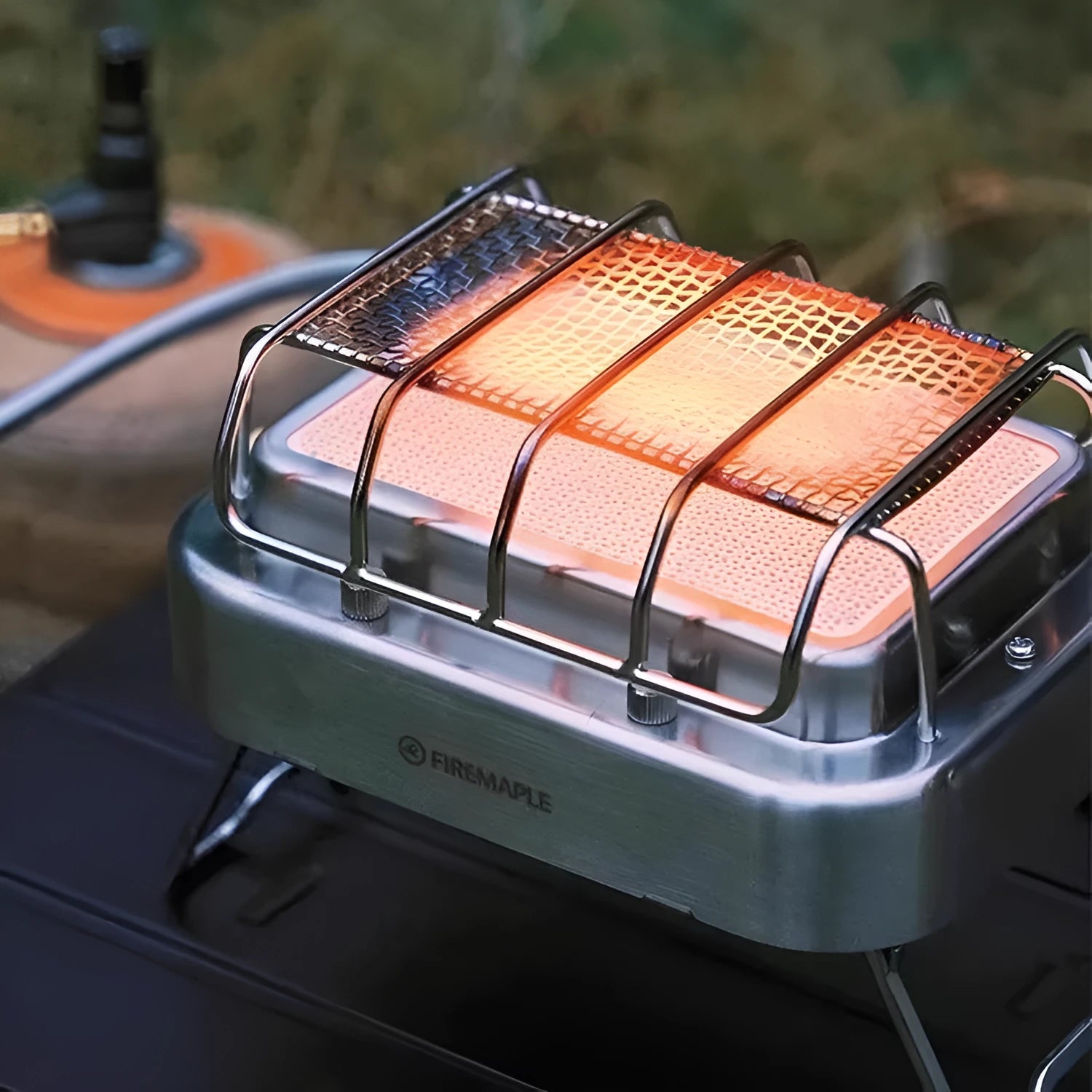 Portable stainless steel electric heating stove with ceramic elements, shown with dimensions.