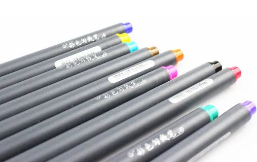 Pack of ten black hook line technical drawing pens with 0.38mm fine tips on a white surface.