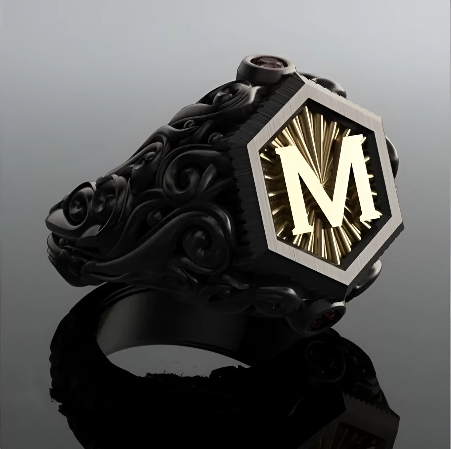 Black alloy decorative ring with carved leaf design on white background