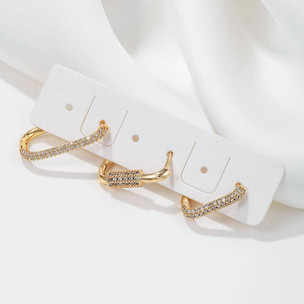 Three geometric square ear clips with micro inlaid zircon in gold and white K colours