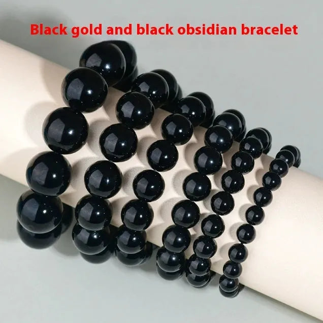Hand-woven obsidian couples bracelet with year of birth engraving and multiple bead diameter options