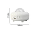 White and black galaxy star projector night light with Bluetooth speaker on a surface.