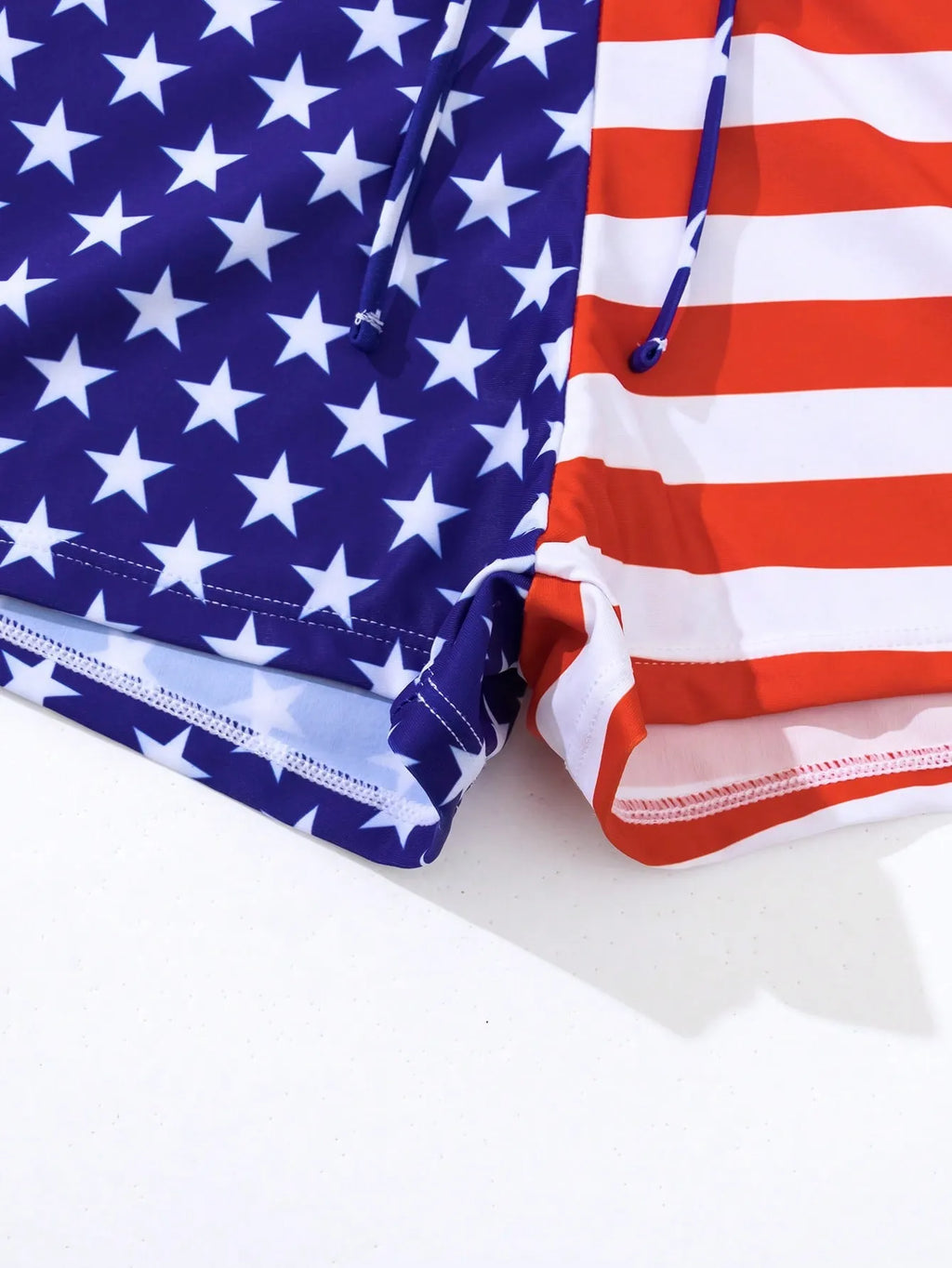 Women's high waist boxer brief swimsuit with drawstring in red, white, and blue stars and stripes pattern