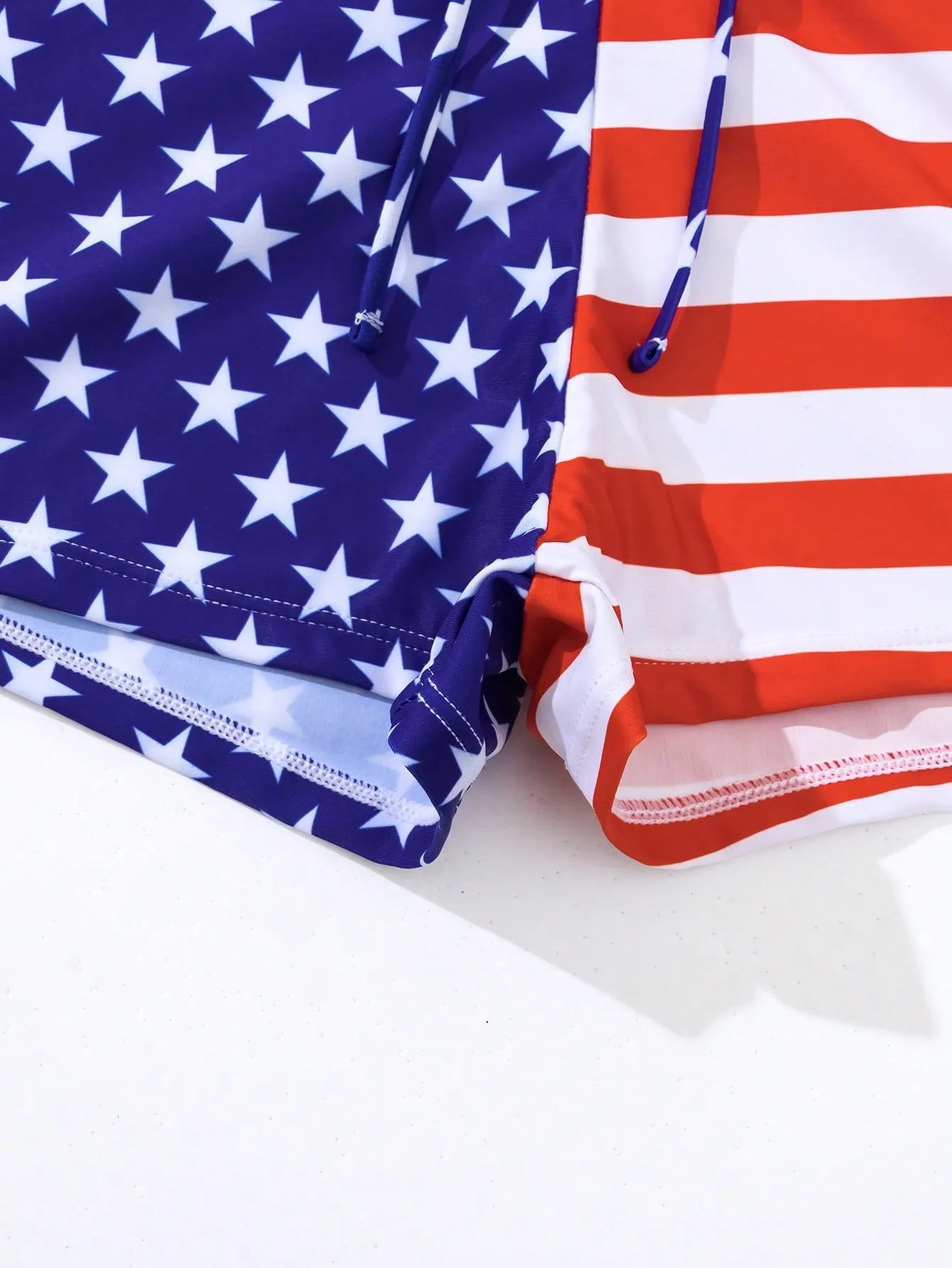 Women's high waist boxer brief swimsuit with drawstring in red, white, and blue stars and stripes pattern