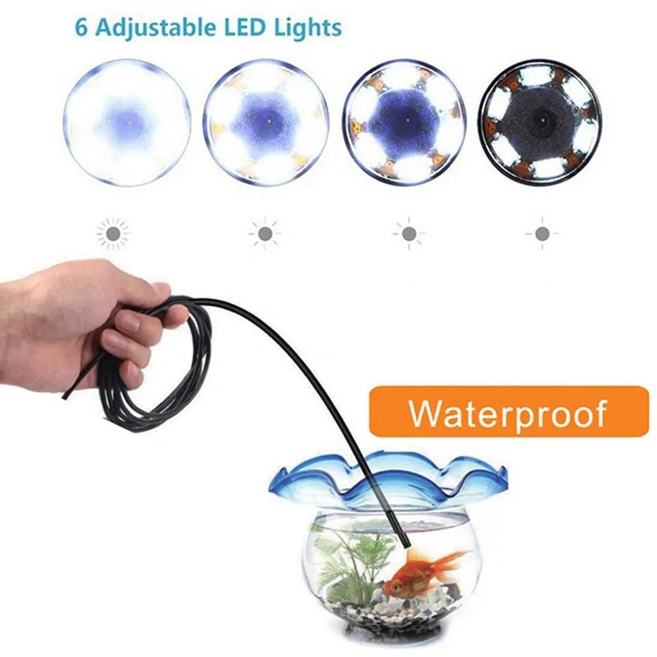 Three-in-one USB endoscope with 5.5mm camera, flexible cable, side mirror, hook, and magnet attachments on a table.