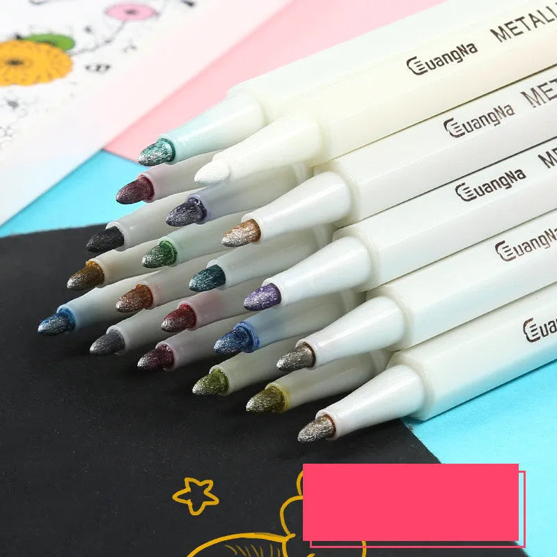 Black plastic card album with coloured metal pens arranged on a white background for office stationery use.
