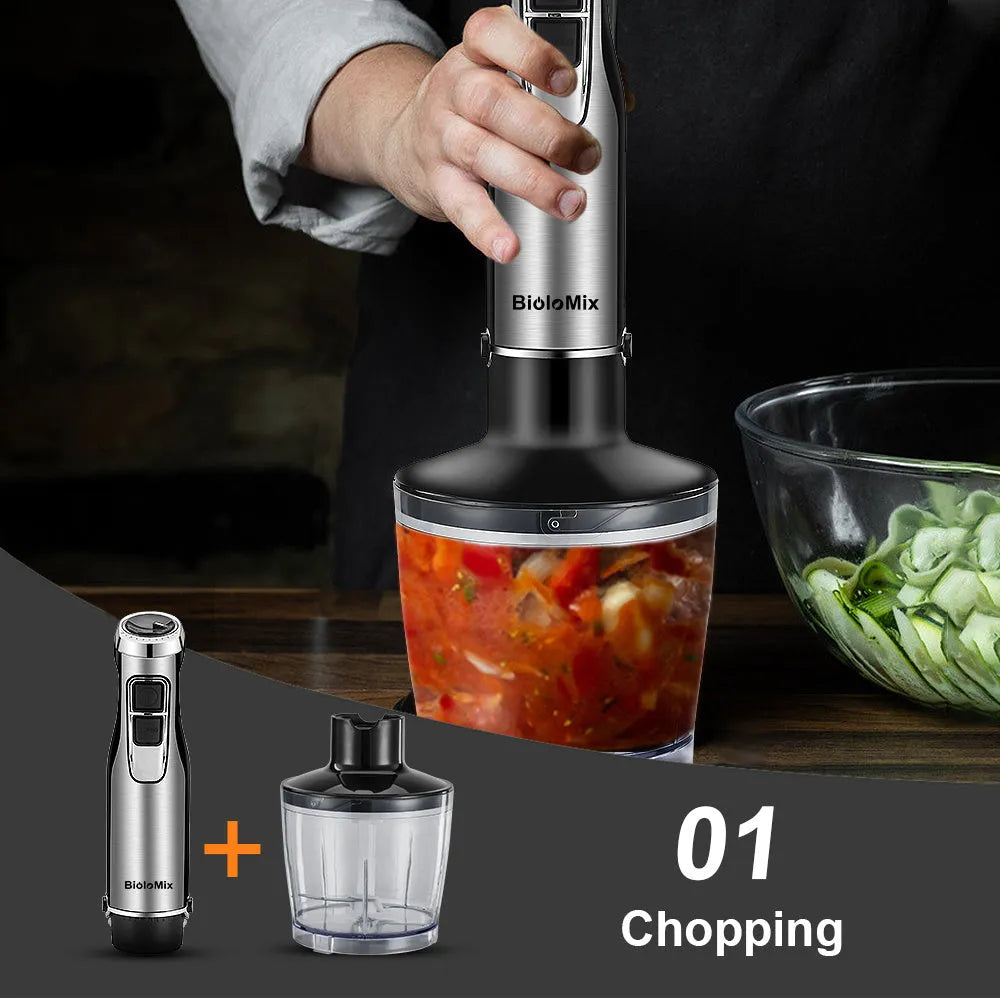 Silver Biolomix hand blender set with stainless steel attachments, chopper bowl, and blending beaker on a kitchen counter