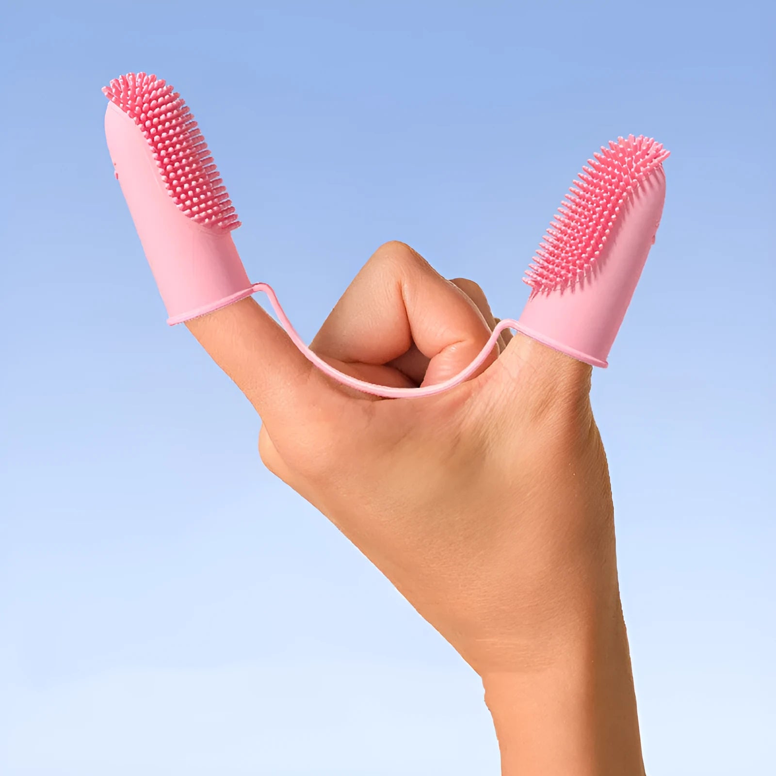 TPR pet tooth cleaning finger cover in blue green, pink, or grass yellow for manual dental care.