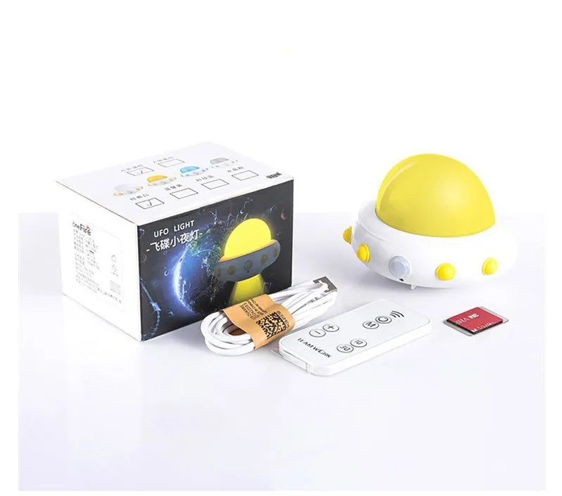 Remote control UFO-shaped bedside night light in blue, pink, or white with cartoon modern design