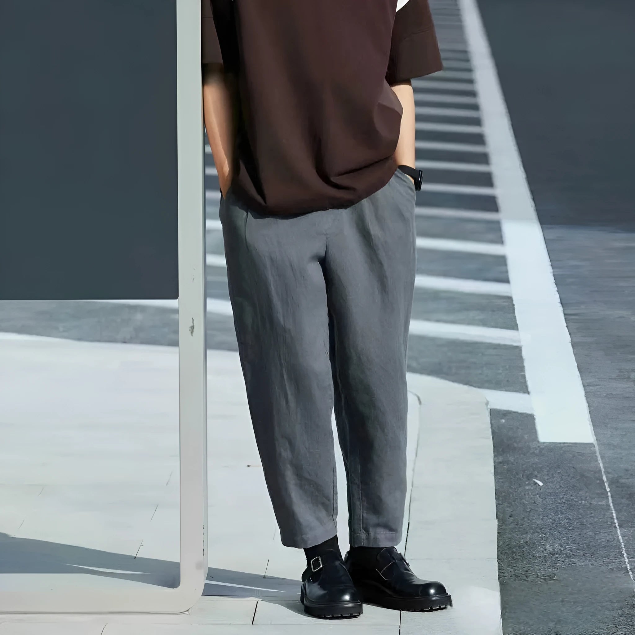 Men's loose-fitting straight-leg casual trousers with a drawstring waistband, shown in a beige colour.