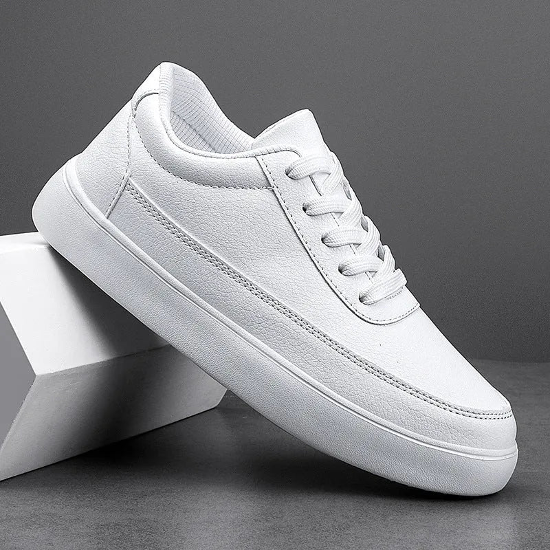 Women's leather flat casual shoes in gold colour with front lace-up closure on a white background.
