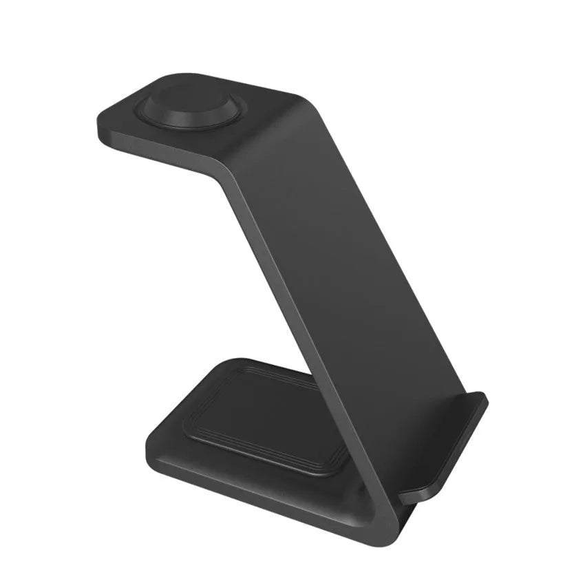 White 3-in-1 wireless charging stand holding a mobile phone, smartwatch, and earbuds on a wooden desk.