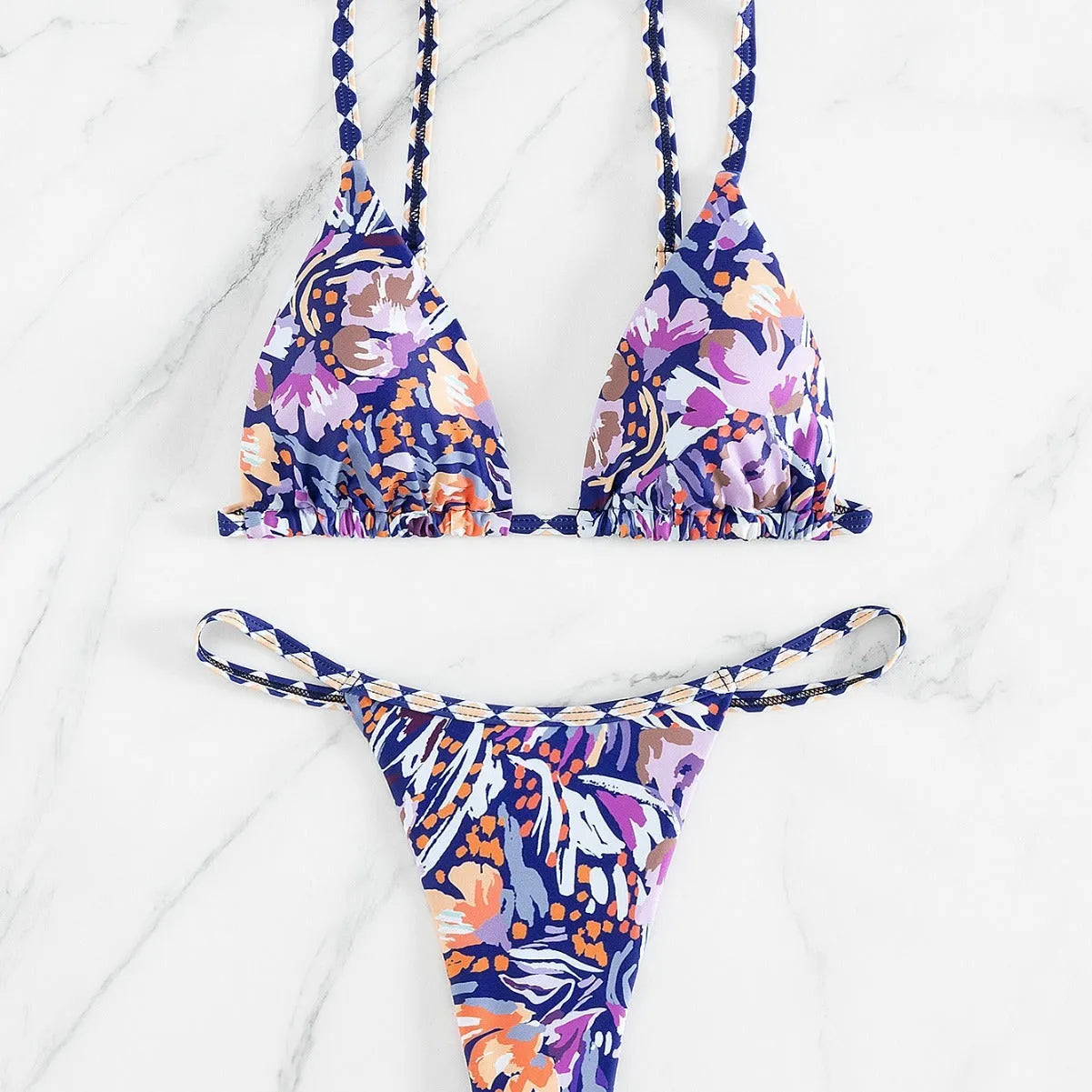 Women's floral print triangle bikini swimsuit with adjustable tie sides on white background