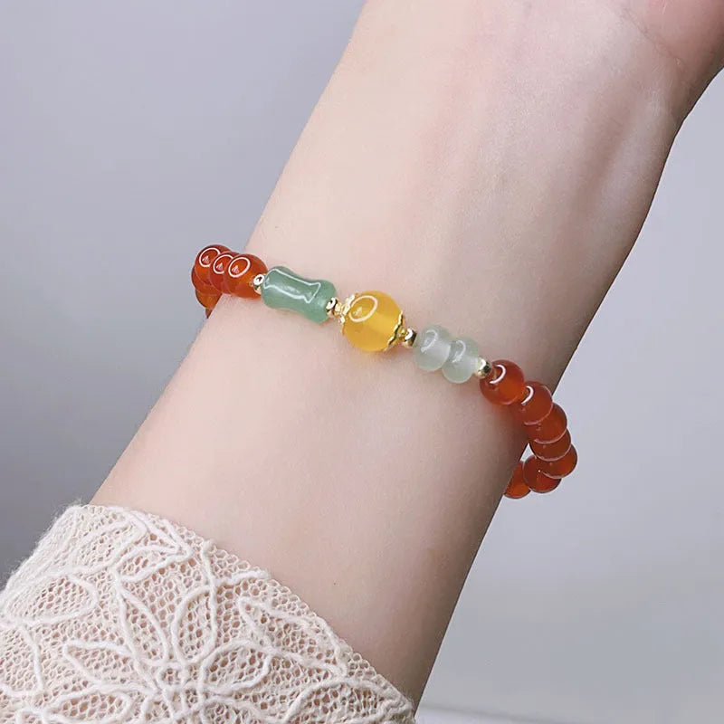 Handcrafted red agate bracelet for women with Chinese dragon design and lucky charm variations