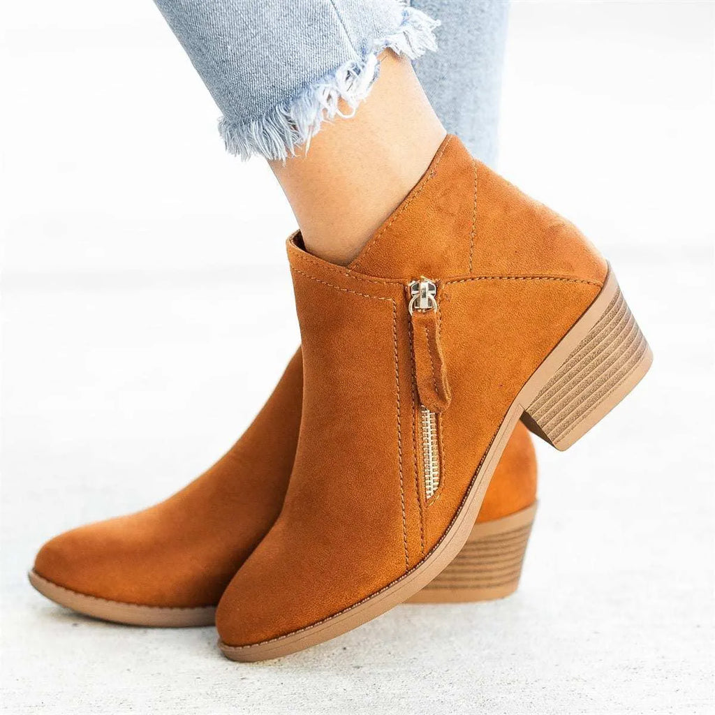 Women's blue suede ankle boots with a chunky heel and a side zip fastener