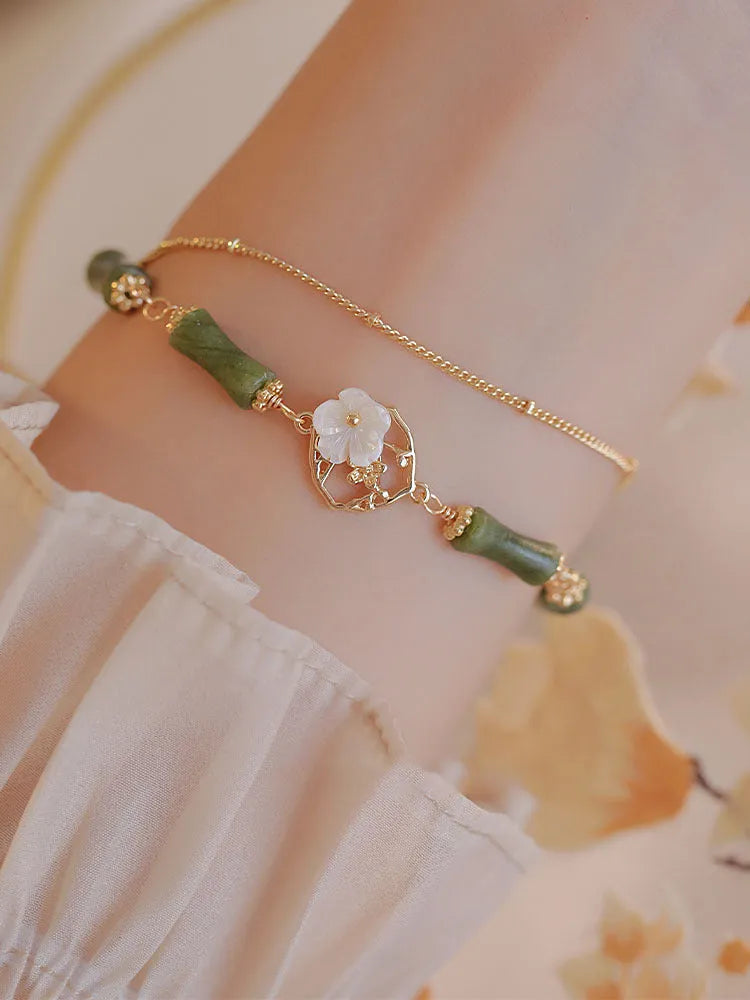 Handmade natural olivine bracelet with Chinese double layer design and olive branch motif.