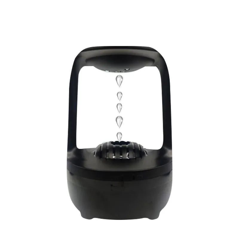 Black and white anti-gravity humidifier showing water droplet effect with USB cable