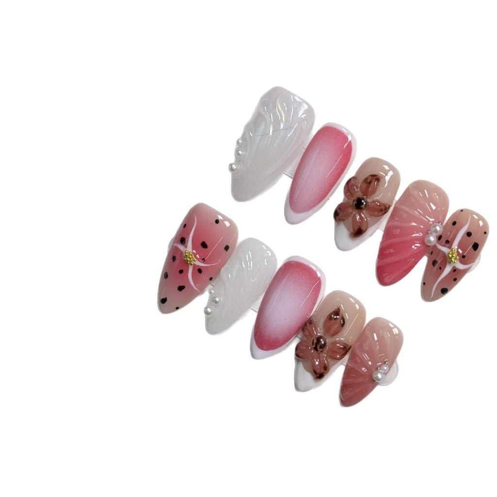 Hand-painted three-dimensional false nails with embossed carved patterns in candy colours.