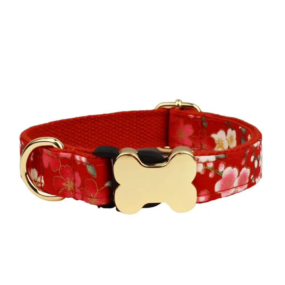 Flat nylon dog collar with a printed grid design and a bone-shaped metal buckle in assorted colours.