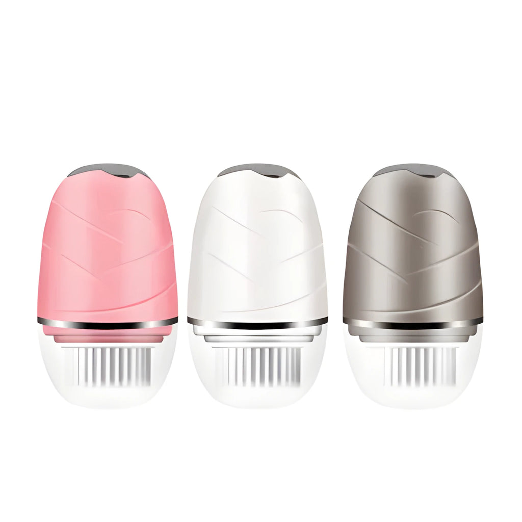 3-in-1 electric facial cleanser with dual speed brush heads and waterproof body in gold, pink, and white