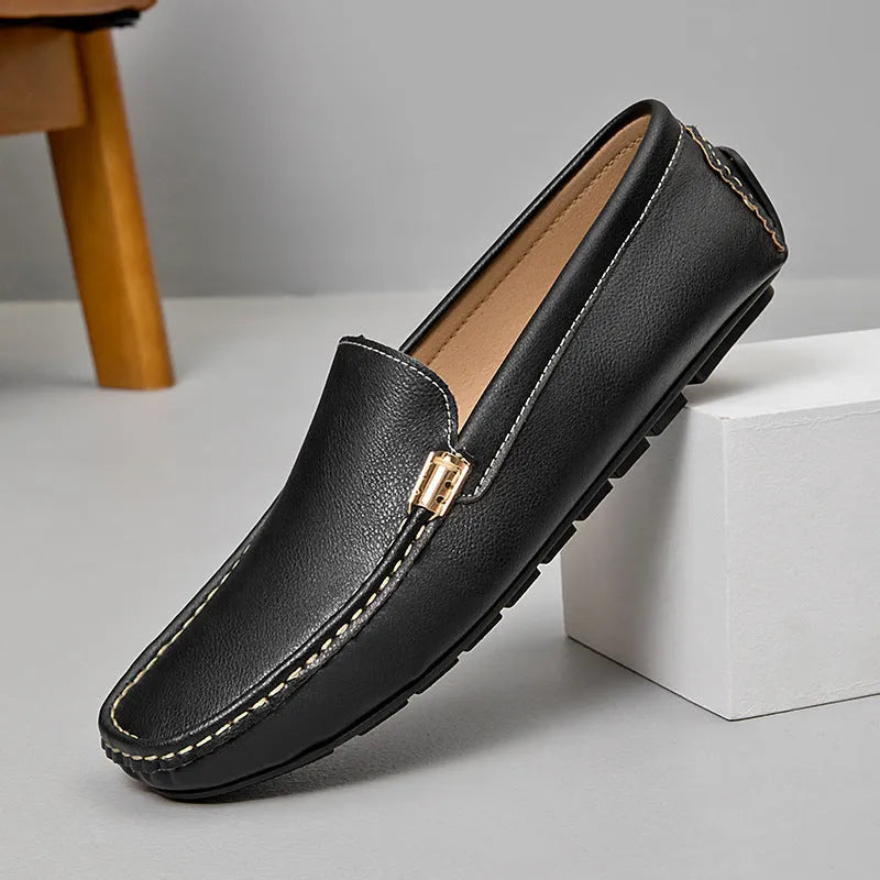 Men's driving shoes in black with matte leather finish, round toe, and flat wedge heel