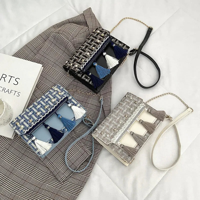 Ethnic-style horizontal square PU bag in beige with polyester lining, medium-hard structure, and flat lay on surface