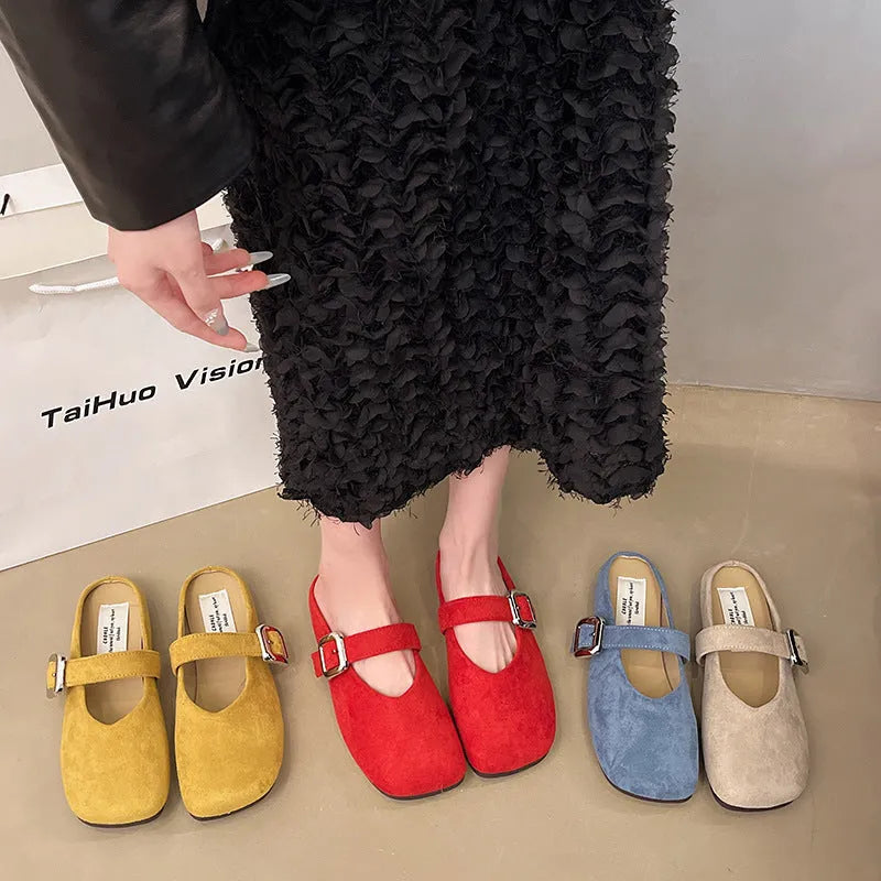 Women's flat apricot coloured slippers with a square toe, PU leather upper, and a dark rubber sole.
