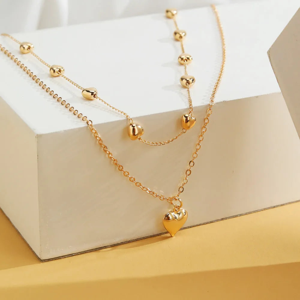 Double-layer gold tone alloy heart pendant curb chain necklace on woman, 51-80cm adjustable length